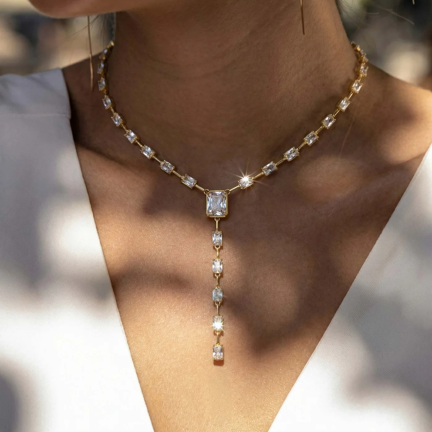Emerald-cut drop neckpiece in daylight